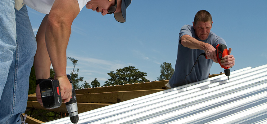 colorcote roofing two men on roof with drills